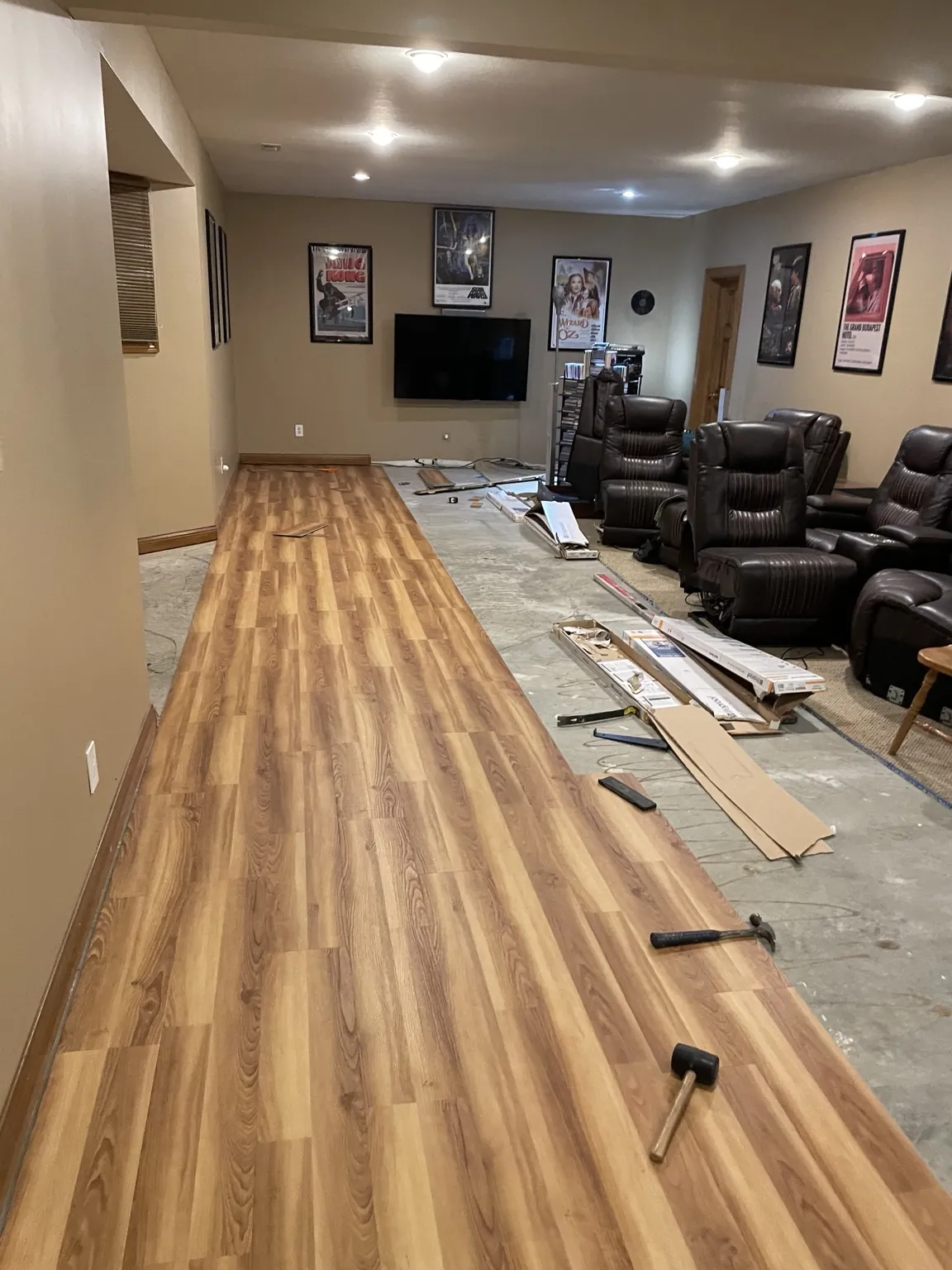 Basement with floating floor installation underway